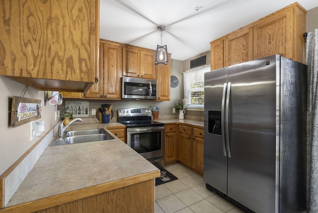 151 Vixen Cir Unit L, Branson, MO 65616 - kitchen featuring appliances with stainless steel finishes, light countertops, brown cabinetry, and light tile patterned floors