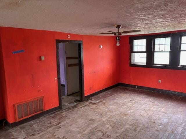 148 E Front St, Fordland, MO 65652 - unfurnished room featuring a ceiling fan and a textured ceiling