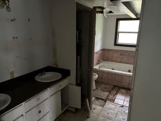 148 E Front St, Fordland, MO 65652 - full bath featuring a whirlpool tub, double vanity, and tile patterned flooring