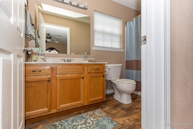 1704 Luna Dr, West Plains, MO 65775 - bathroom with vanity, wood finished floors, and a ceiling fan
