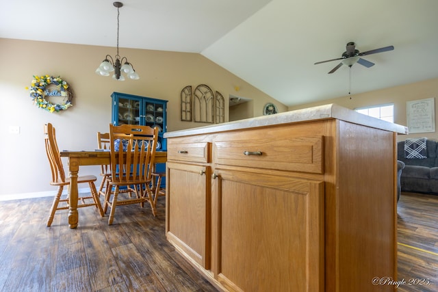 1704 Luna Dr, West Plains, MO 65775 - dining space featuring lofted ceiling, dark wood-style floors, a chandelier, and a ceiling fan