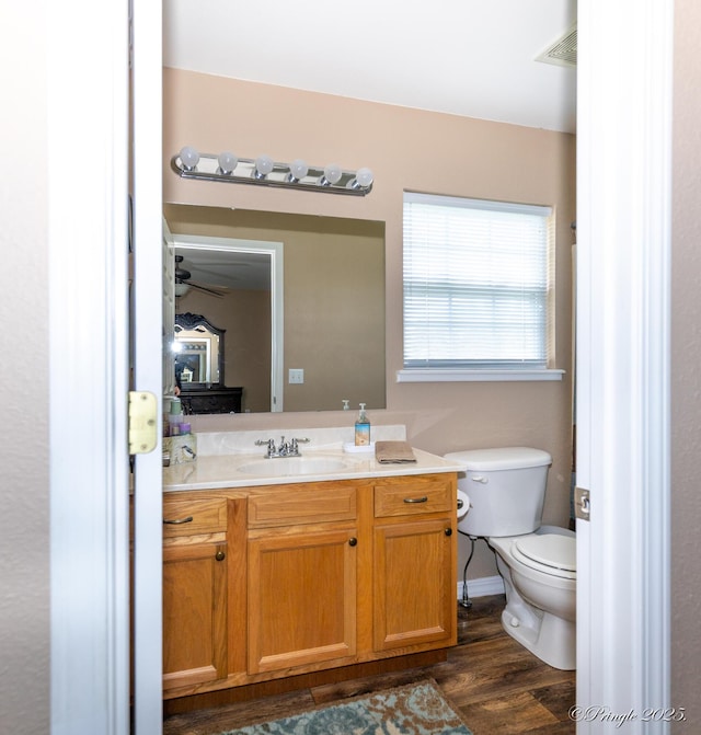 1704 Luna Dr, West Plains, MO 65775 - bathroom featuring vanity, wood finished floors, and ceiling fan