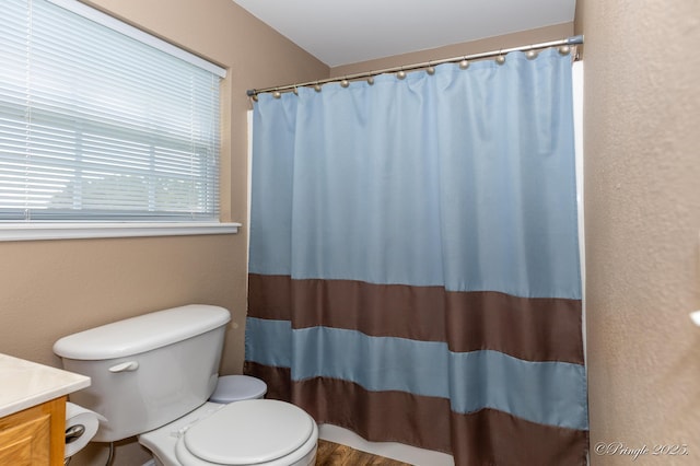1704 Luna Dr, West Plains, MO 65775 - full bathroom featuring vanity, curtained shower, and a textured wall
