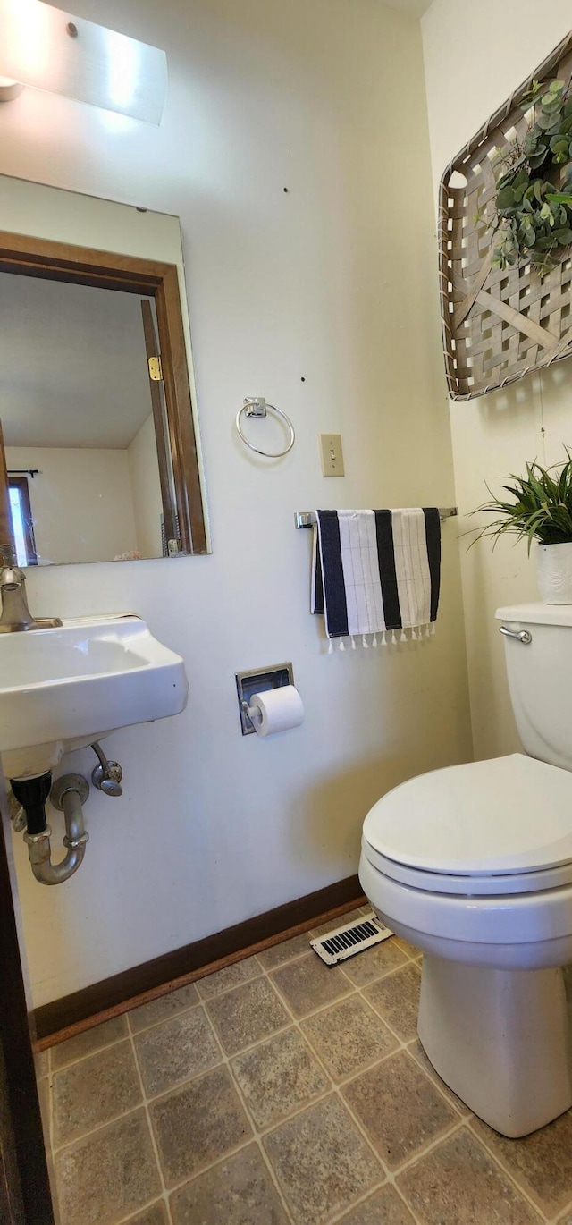 16 Magnolia Ct Unit B, Branson, MO 65616 - bathroom featuring toilet and baseboards