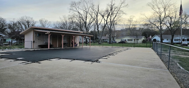 16 Magnolia Ct Unit B, Branson, MO 65616 - pool at dusk featuring a residential view