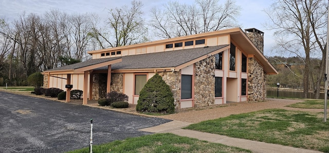16 Magnolia Ct Unit B, Branson, MO 65616 - mid-century home with stone siding, a chimney, stucco siding, and roof with shingles