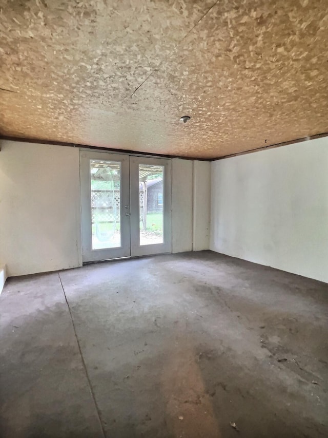 505 Sycamore St, Van Buren, MO 63965 - empty room featuring unfinished concrete flooring and french doors