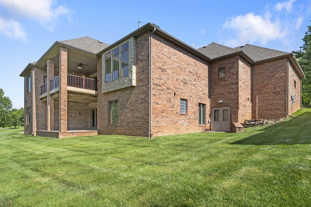 755 N Fallbrooke Ter, Springfield, MO 65802 - back of house with a balcony, brick siding, ceiling fan, and a yard