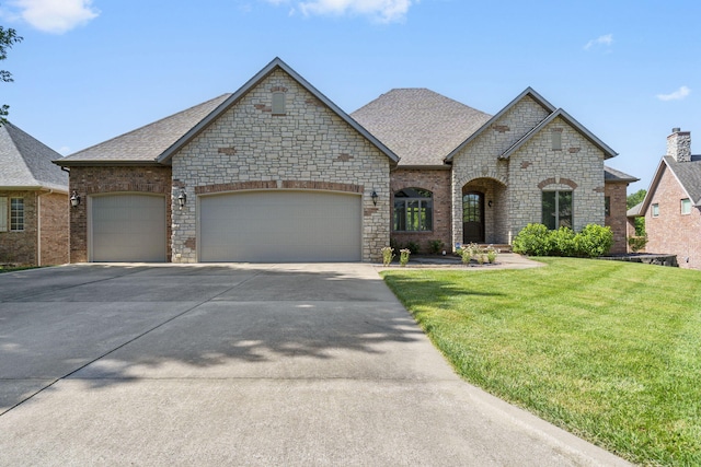 755 N Fallbrooke Ter, Springfield, MO 65802 - french country inspired facade with concrete driveway, a garage, a front yard, and a shingled roof