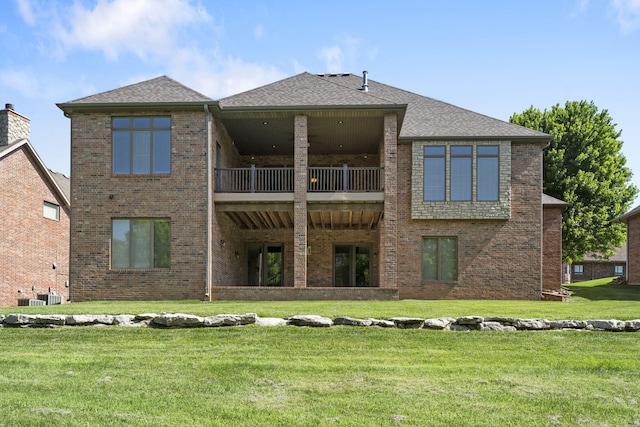 755 N Fallbrooke Ter, Springfield, MO 65802 - rear view of property with brick siding, a lawn, a balcony, and roof with shingles