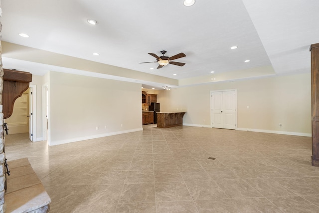 755 N Fallbrooke Ter, Springfield, MO 65802 - unfurnished living room with ceiling fan, recessed lighting, and light tile patterned floors