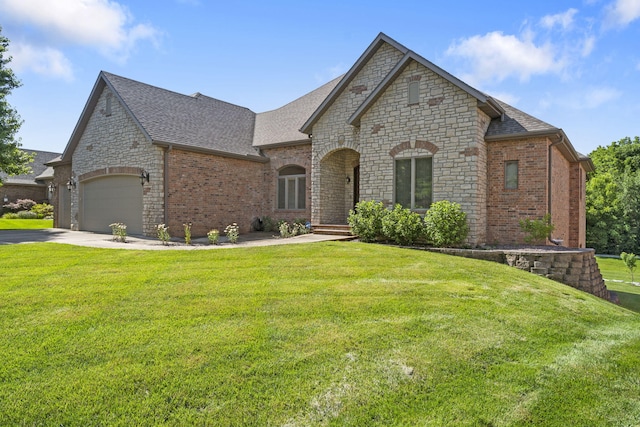 755 N Fallbrooke Ter, Springfield, MO 65802 - french country inspired facade featuring driveway, a shingled roof, a front lawn, and brick siding