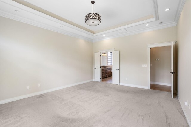 755 N Fallbrooke Ter, Springfield, MO 65802 - unfurnished bedroom featuring ornamental molding, light colored carpet, recessed lighting, a tray ceiling, and ensuite bath
