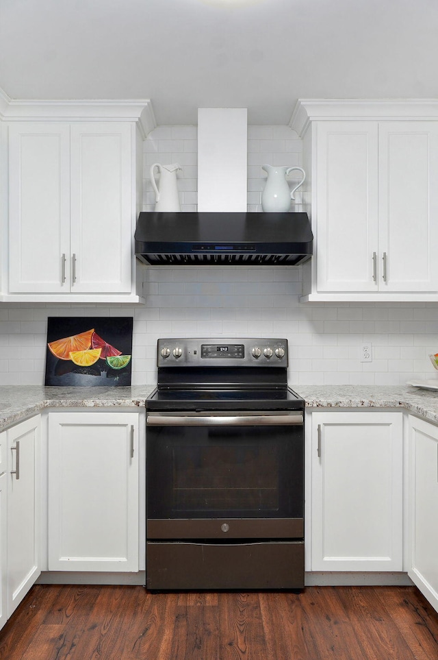 263 Crystal Ave, Sparta, MO 65753 - kitchen with stainless steel electric range, wall chimney exhaust hood, tasteful backsplash, and white cabinets