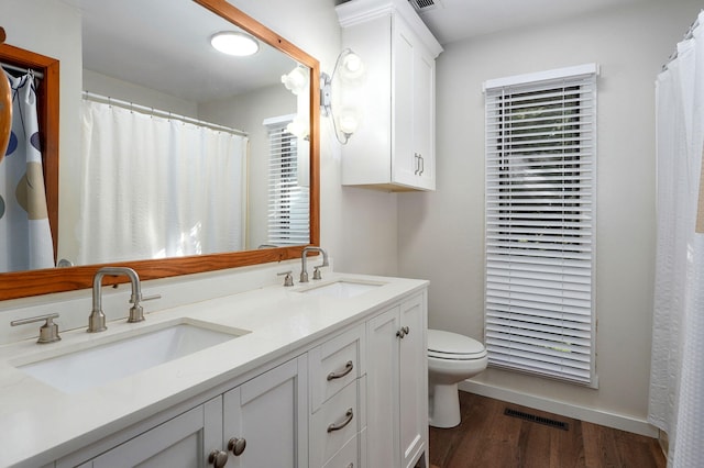 263 Crystal Ave, Sparta, MO 65753 - full bath featuring double vanity, wood finished floors, and a shower with shower curtain
