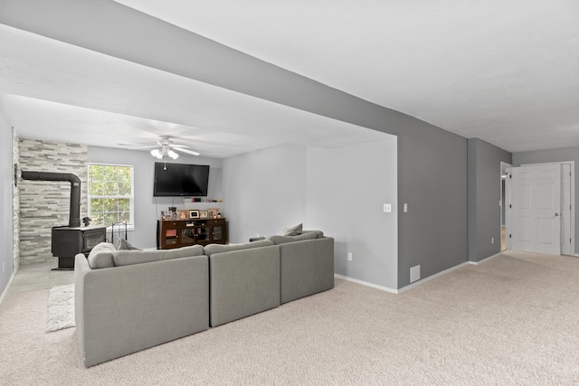 1917 Willoughby Rd, Clever, MO 65631 - carpeted living room with a wood stove and ceiling fan
