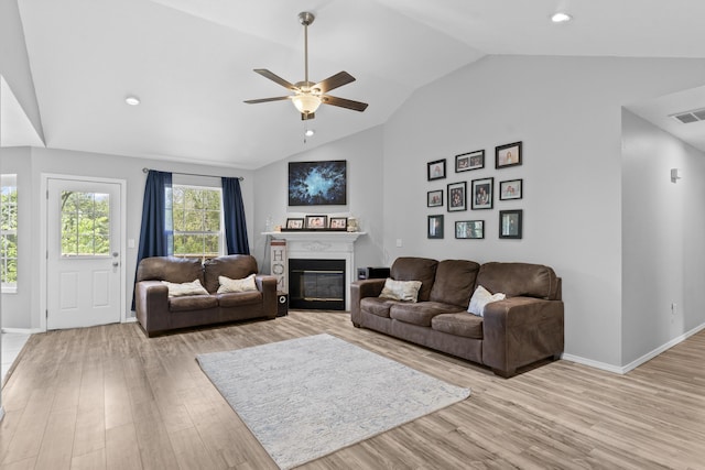 1917 Willoughby Rd, Clever, MO 65631 - living room with light wood-type flooring, a glass covered fireplace, ceiling fan, recessed lighting, and high vaulted ceiling
