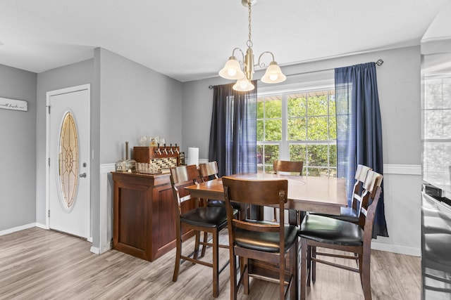 1917 Willoughby Rd, Clever, MO 65631 - dining area with a chandelier and wood finished floors