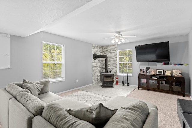 1917 Willoughby Rd, Clever, MO 65631 - living room with a wood stove, healthy amount of natural light, and a ceiling fan