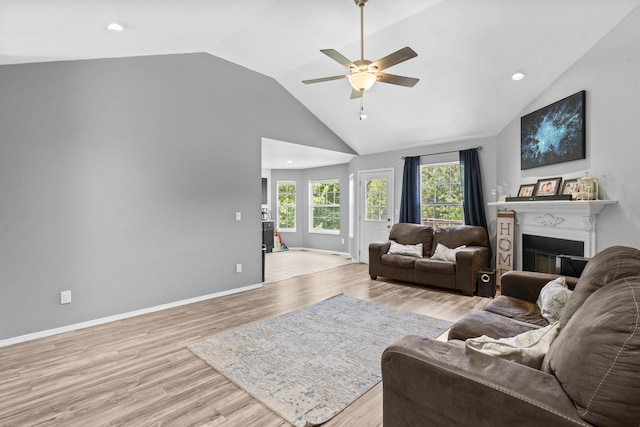 1917 Willoughby Rd, Clever, MO 65631 - living room featuring a ceiling fan, a glass covered fireplace, light wood-style flooring, recessed lighting, and high vaulted ceiling
