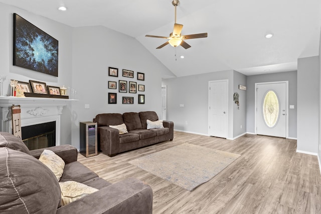 1917 Willoughby Rd, Clever, MO 65631 - living room with ceiling fan, a glass covered fireplace, wood finished floors, high vaulted ceiling, and recessed lighting