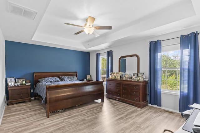 1917 Willoughby Rd, Clever, MO 65631 - bedroom featuring a tray ceiling, wood finished floors, and ceiling fan
