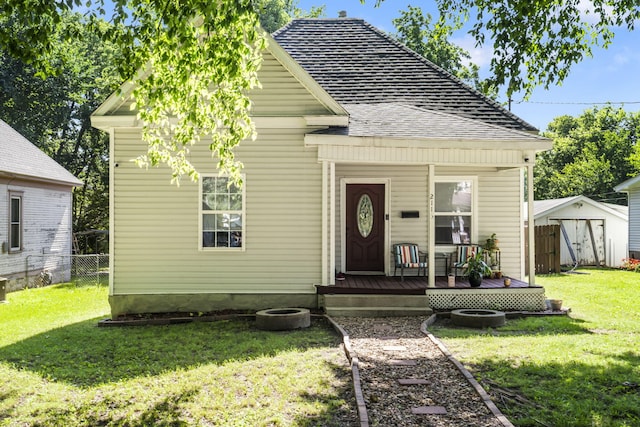 2116 N Main Ave, Springfield, MO 65803 - view of front of house featuring a shed and a wooden deck