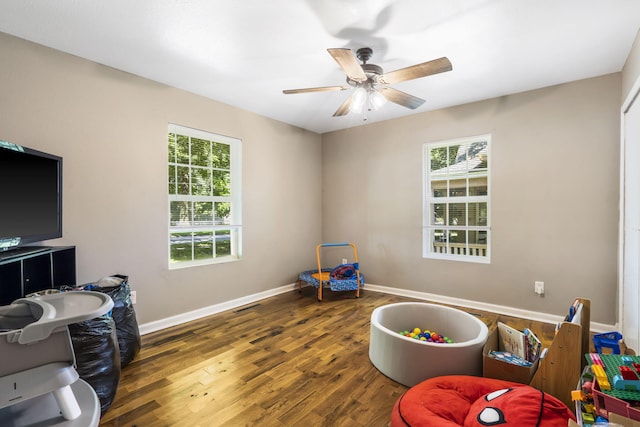 2116 N Main Ave, Springfield, MO 65803 - recreation room with healthy amount of natural light, wood finished floors, and ceiling fan