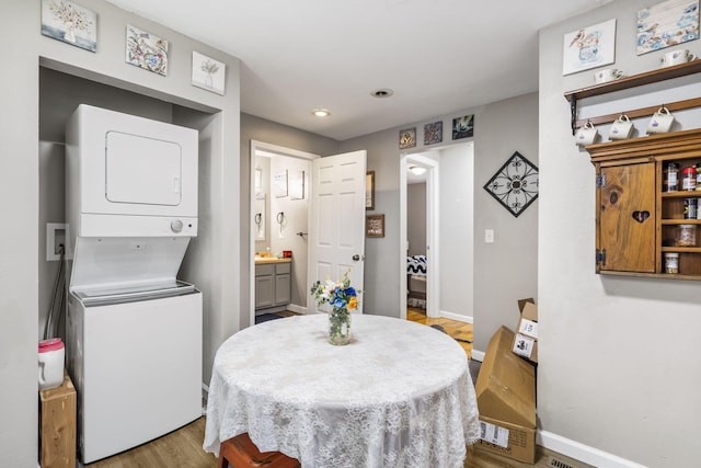 2116 N Main Ave, Springfield, MO 65803 - dining room featuring stacked washer and clothes dryer, recessed lighting, and light wood-style floors