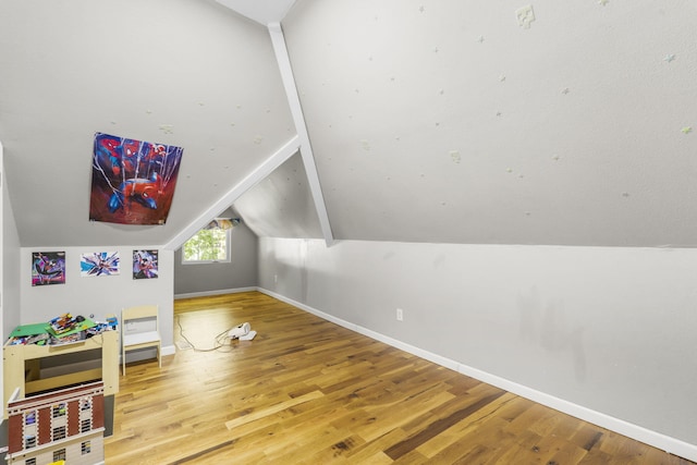 2116 N Main Ave, Springfield, MO 65803 - rec room featuring vaulted ceiling and wood finished floors