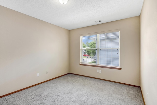 5590 S Aaron Ave, Springfield, MO 65810 - unfurnished room featuring carpet flooring and a textured ceiling