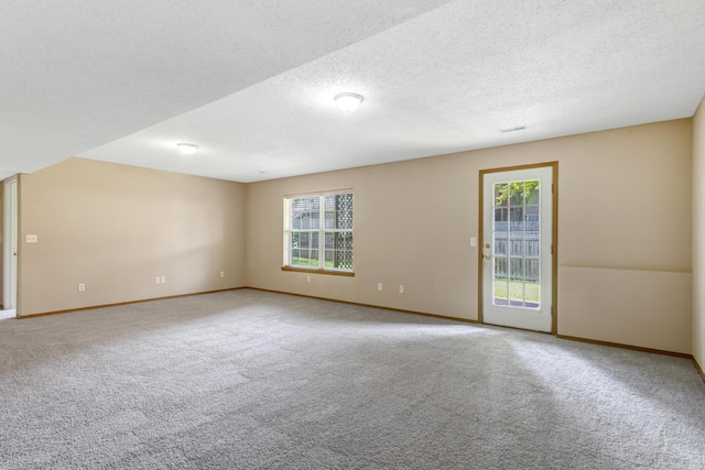 5590 S Aaron Ave, Springfield, MO 65810 - carpeted empty room with baseboards and a textured ceiling