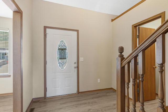 5590 S Aaron Ave, Springfield, MO 65810 - foyer entrance with light wood-style floors and stairs