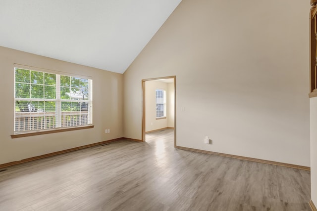 5590 S Aaron Ave, Springfield, MO 65810 - spare room featuring light wood-style floors and high vaulted ceiling