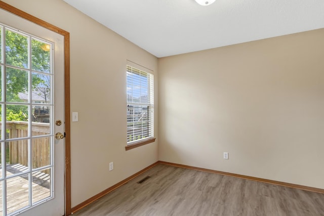 5590 S Aaron Ave, Springfield, MO 65810 - empty room with light wood-style floors and baseboards