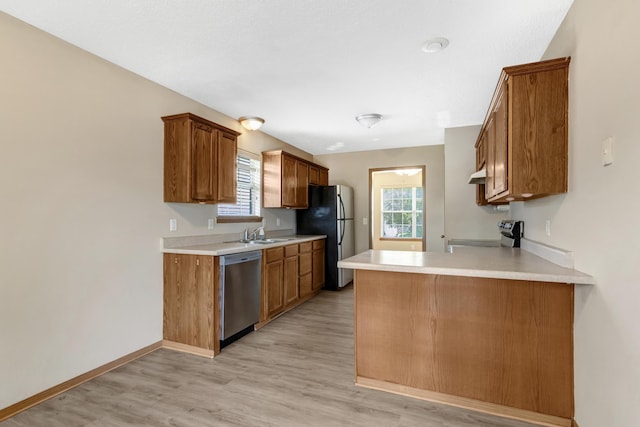 5590 S Aaron Ave, Springfield, MO 65810 - kitchen featuring stainless steel dishwasher, freestanding refrigerator, stove, and healthy amount of natural light