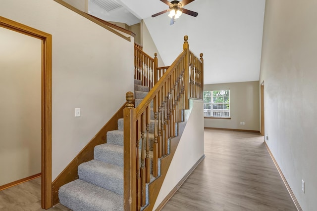 5590 S Aaron Ave, Springfield, MO 65810 - staircase with wood finished floors, a ceiling fan, and high vaulted ceiling