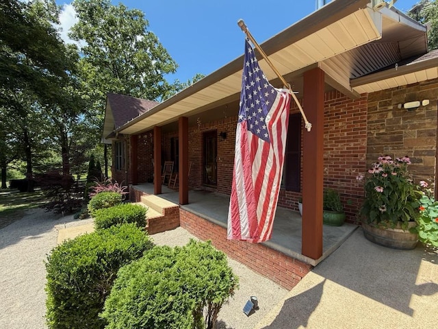16051 Mo 142, Thayer, MO 65791 - view of exterior entry with brick siding and a porch