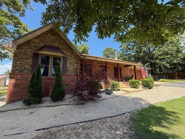 16051 Mo 142, Thayer, MO 65791 - view of front of house featuring brick siding, covered porch, a garage, and driveway