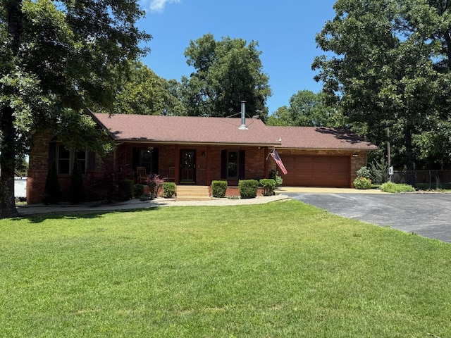 16051 Mo 142, Thayer, MO 65791 - ranch-style house featuring driveway, a garage, a front lawn, a porch, and brick siding