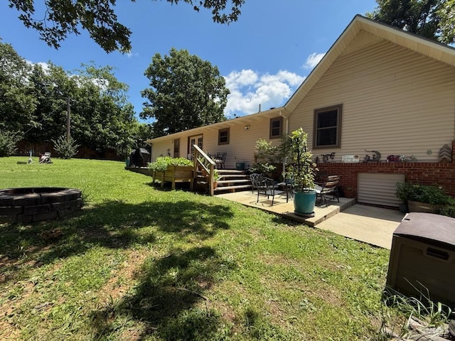 16051 Mo 142, Thayer, MO 65791 - view of grassy yard with a patio area, a wooden deck, and an outdoor fire pit