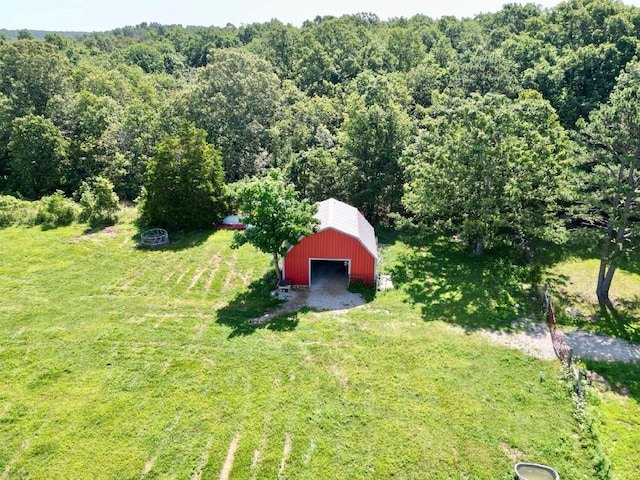 16051 Mo 142, Thayer, MO 65791 - view of grassy yard with a detached garage, an outdoor structure, an outbuilding, and a forest view