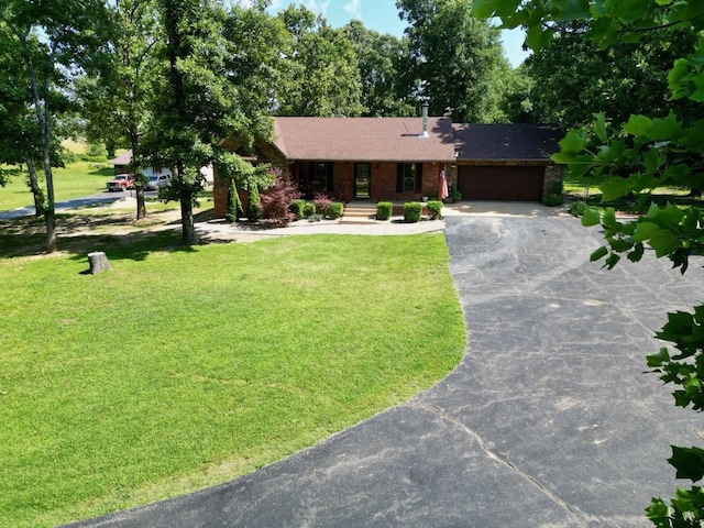 16051 Mo 142, Thayer, MO 65791 - ranch-style home with asphalt driveway, an attached garage, a front lawn, and brick siding