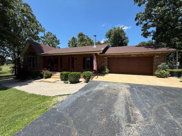 16051 Mo 142, Thayer, MO 65791 - single story home featuring driveway, a porch, an attached garage, and brick siding