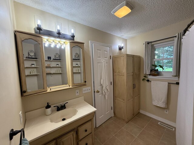 16051 Mo 142, Thayer, MO 65791 - full bath featuring a textured ceiling, vanity, and tile patterned flooring