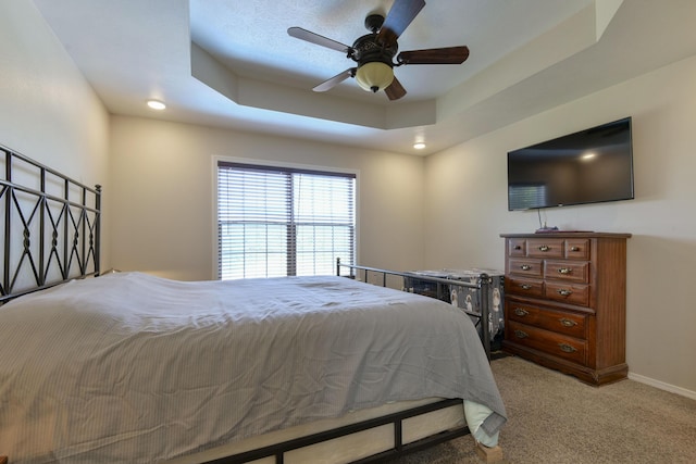 440 Spring Meadow Pkwy, Branson, MO 65616 - bedroom with light carpet, a ceiling fan, and a tray ceiling