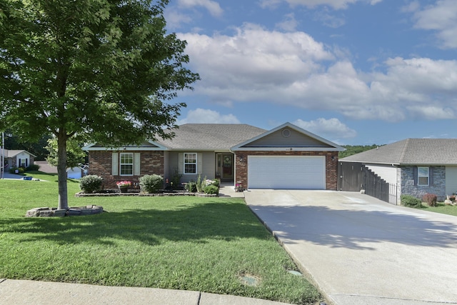 440 Spring Meadow Pkwy, Branson, MO 65616 - ranch-style home featuring a garage, concrete driveway, and brick siding