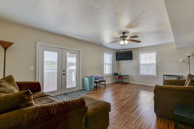440 Spring Meadow Pkwy, Branson, MO 65616 - living room with french doors, wood-type flooring, a textured ceiling, and ceiling fan