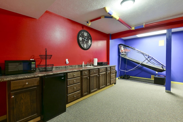 440 Spring Meadow Pkwy, Branson, MO 65616 - indoor wet bar with black appliances, light carpet, and a textured ceiling
