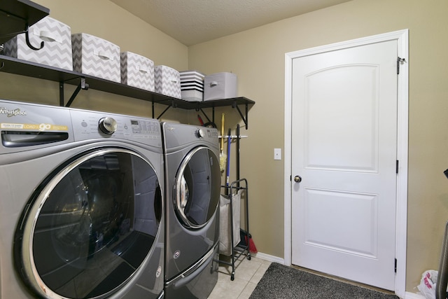 440 Spring Meadow Pkwy, Branson, MO 65616 - laundry area featuring washer and clothes dryer and light tile patterned floors